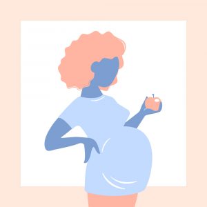 Pregnant woman holding an apple